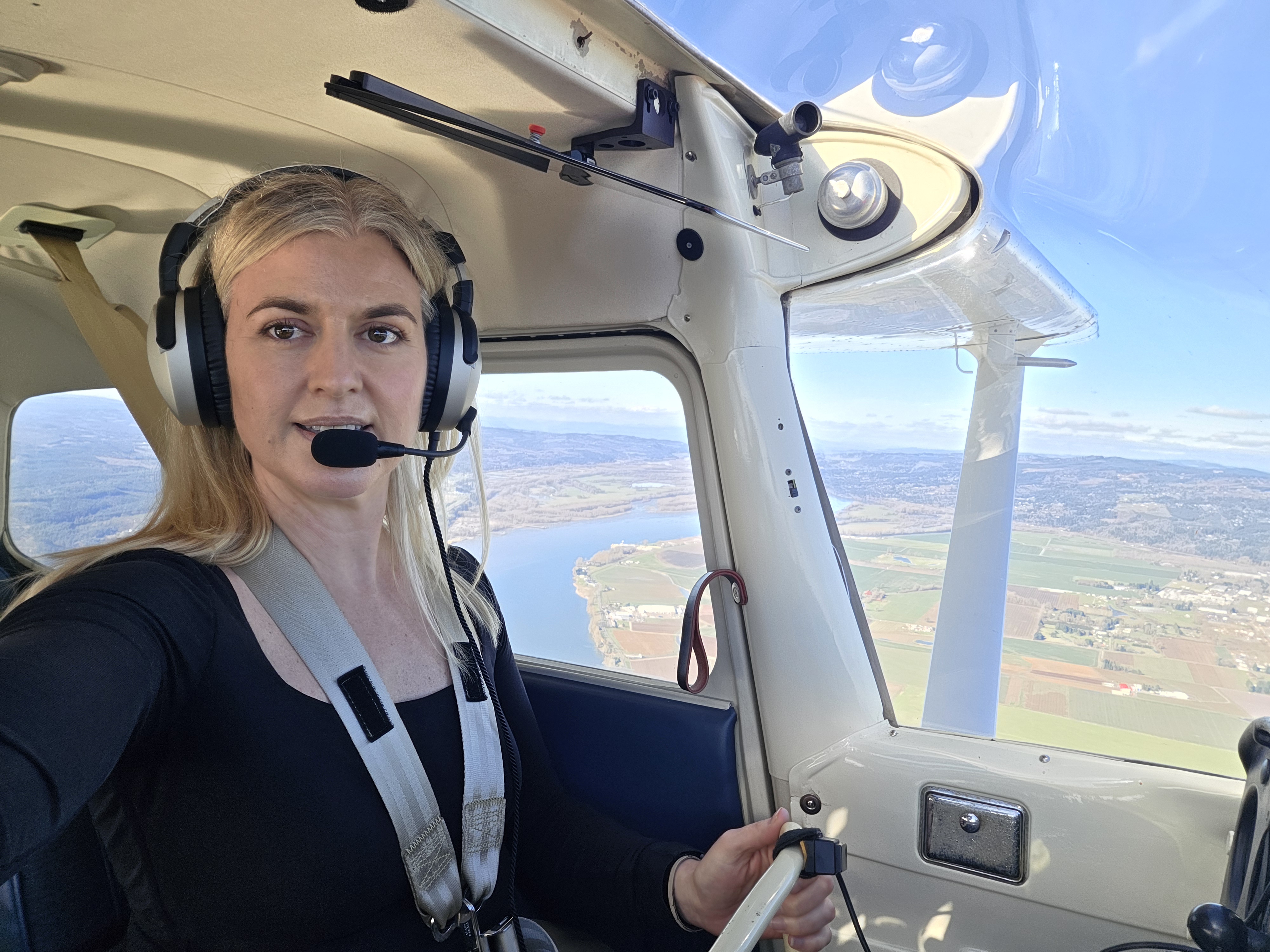 Suz flying a plane in the cockpit